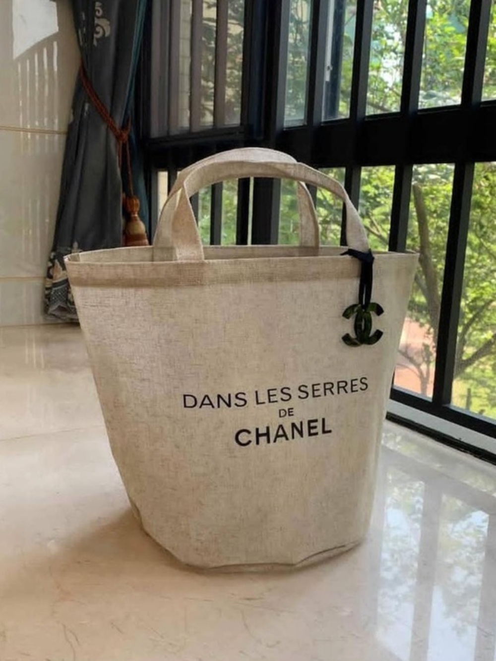 CHANEL Natural Beige Canvas 'Dans Les Serres' Tote with Logo Charm Straw /Rattan